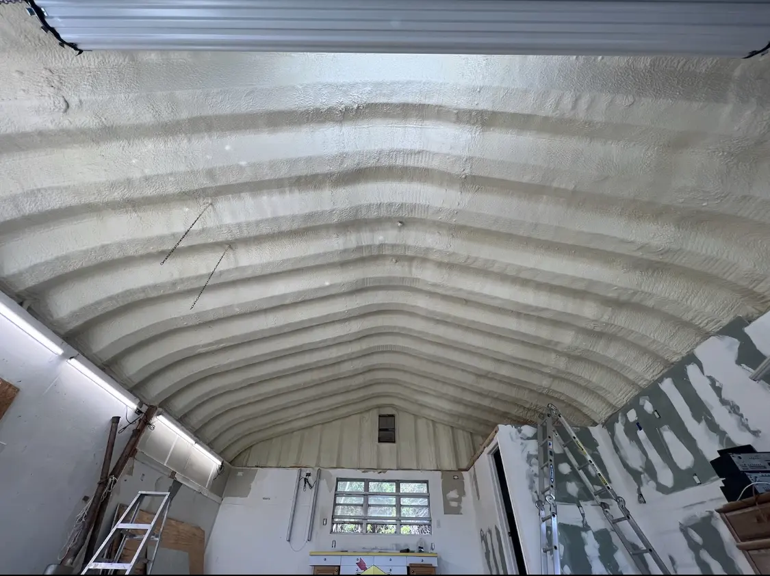 Spray polyurethane foam applied to the underside of a metal roof deck in Nampa